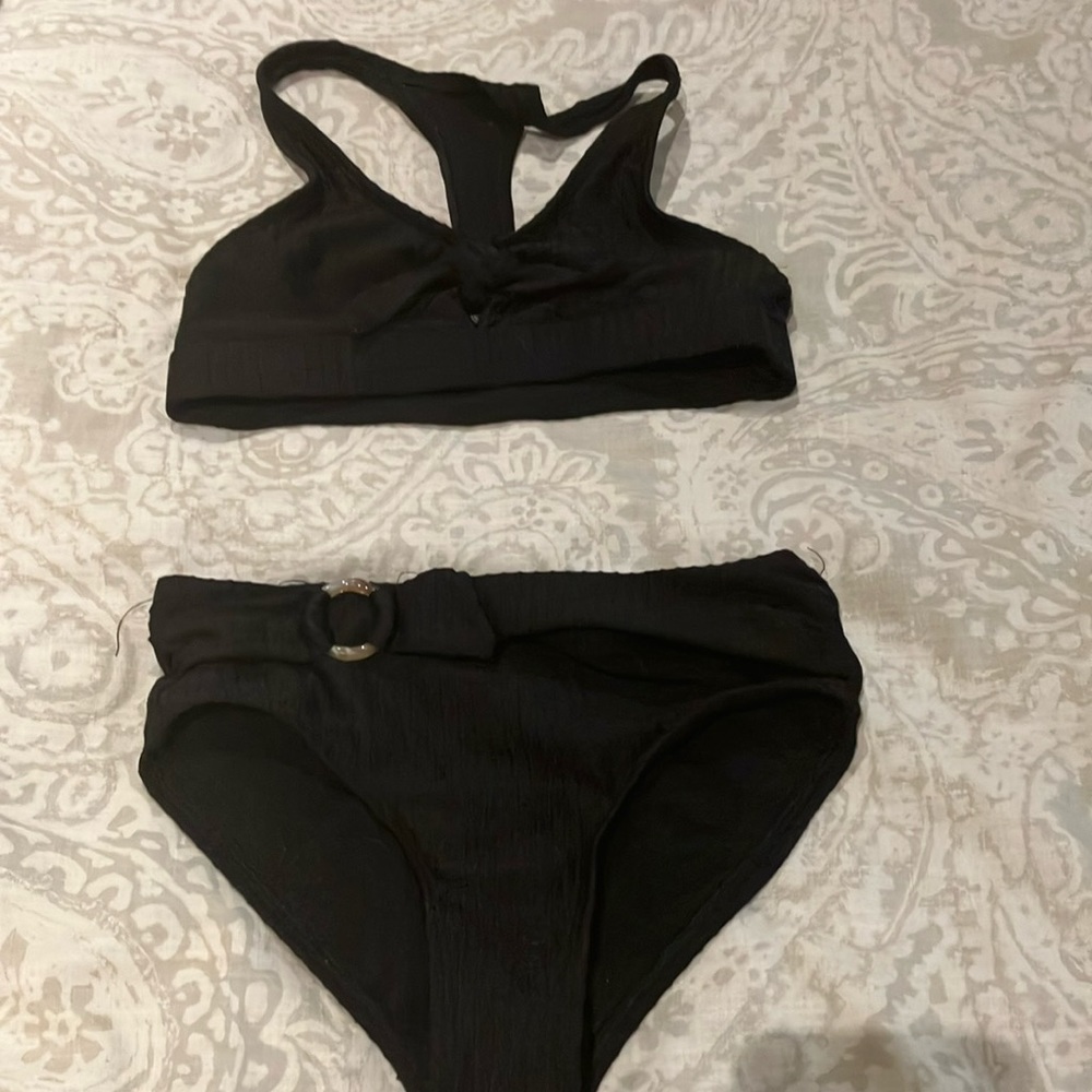 Cute black bathing suit with a bow and stripes.